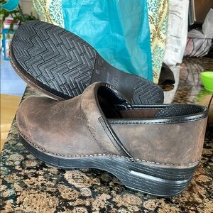 Dansko Brown and Black Clogs